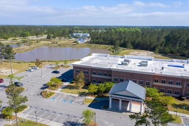 Enjoy easy, single-level, maintenance-free living in this on Cape Fear National At Brunswick Forest in North Carolina - for sale on GolfHomes.com, golf home, golf lot