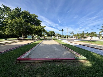 This waterfront half duplex is now available to purchase, or on Key Colony Beach Golf Course in Florida - for sale on GolfHomes.com, golf home, golf lot