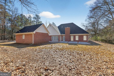 Discover this exquisite sprawling ranch home in the highly on Canongate At Georgia National Golf Club in Georgia - for sale on GolfHomes.com, golf home, golf lot