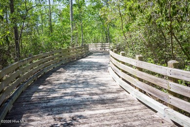 Enjoy easy, single-level, maintenance-free living in this on Cape Fear National At Brunswick Forest in North Carolina - for sale on GolfHomes.com, golf home, golf lot