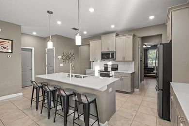 Don't miss this stunning 5-bedroom, 4.5-bath home offering over on The Oasis Club at Champions Gate in Florida - for sale on GolfHomes.com, golf home, golf lot