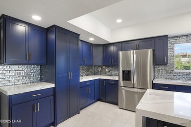 Discover luxury living with stunning mountain, lake, pond, and on London Bridge Golf Course in Arizona - for sale on GolfHomes.com, golf home, golf lot