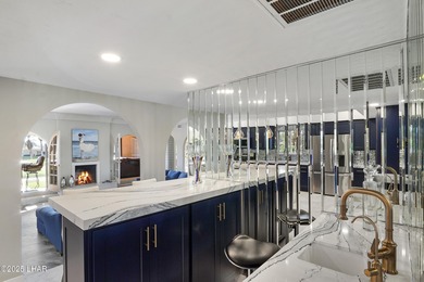 Discover luxury living with stunning mountain, lake, pond, and on London Bridge Golf Course in Arizona - for sale on GolfHomes.com, golf home, golf lot