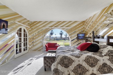 Discover luxury living with stunning mountain, lake, pond, and on London Bridge Golf Course in Arizona - for sale on GolfHomes.com, golf home, golf lot