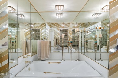 Discover luxury living with stunning mountain, lake, pond, and on London Bridge Golf Course in Arizona - for sale on GolfHomes.com, golf home, golf lot