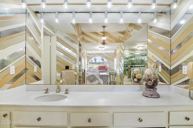 Discover luxury living with stunning mountain, lake, pond, and on London Bridge Golf Course in Arizona - for sale on GolfHomes.com, golf home, golf lot