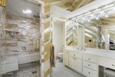 Discover luxury living with stunning mountain, lake, pond, and on London Bridge Golf Course in Arizona - for sale on GolfHomes.com, golf home, golf lot