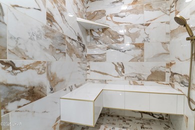 Discover luxury living with stunning mountain, lake, pond, and on London Bridge Golf Course in Arizona - for sale on GolfHomes.com, golf home, golf lot