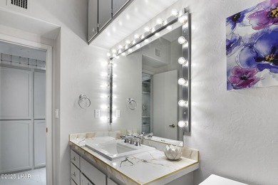 Discover luxury living with stunning mountain, lake, pond, and on London Bridge Golf Course in Arizona - for sale on GolfHomes.com, golf home, golf lot