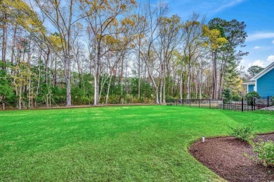 Discover an exquisite blend of style and modern convenience at on Wild Wing Plantation in South Carolina - for sale on GolfHomes.com, golf home, golf lot