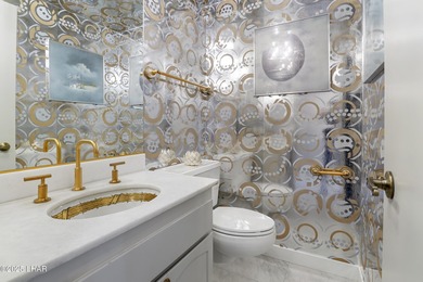 Discover luxury living with stunning mountain, lake, pond, and on London Bridge Golf Course in Arizona - for sale on GolfHomes.com, golf home, golf lot