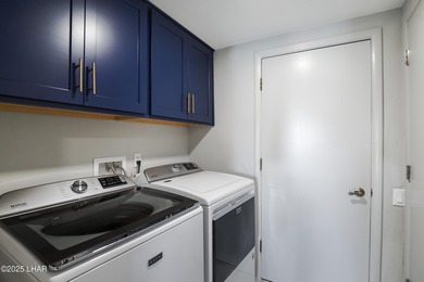 Discover luxury living with stunning mountain, lake, pond, and on London Bridge Golf Course in Arizona - for sale on GolfHomes.com, golf home, golf lot