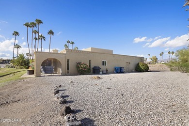 Discover luxury living with stunning mountain, lake, pond, and on London Bridge Golf Course in Arizona - for sale on GolfHomes.com, golf home, golf lot