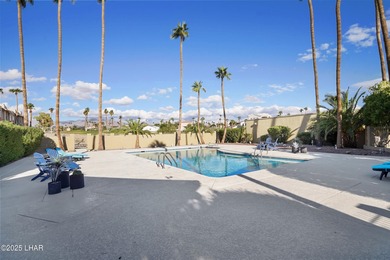 Discover luxury living with stunning mountain, lake, pond, and on London Bridge Golf Course in Arizona - for sale on GolfHomes.com, golf home, golf lot