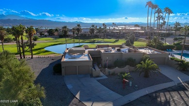 Discover luxury living with stunning mountain, lake, pond, and on London Bridge Golf Course in Arizona - for sale on GolfHomes.com, golf home, golf lot