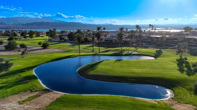 Discover luxury living with stunning mountain, lake, pond, and on London Bridge Golf Course in Arizona - for sale on GolfHomes.com, golf home, golf lot