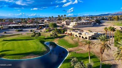 Discover luxury living with stunning mountain, lake, pond, and on London Bridge Golf Course in Arizona - for sale on GolfHomes.com, golf home, golf lot