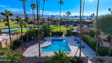 Discover luxury living with stunning mountain, lake, pond, and on London Bridge Golf Course in Arizona - for sale on GolfHomes.com, golf home, golf lot