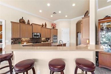 This sought-after Aragon model sits on a premium lakefront lot on Estero Country Club in Florida - for sale on GolfHomes.com, golf home, golf lot