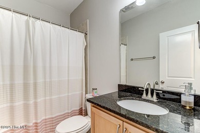 Beautifully updated townhouse tucked away in a peaceful on Cape Fear National At Brunswick Forest in North Carolina - for sale on GolfHomes.com, golf home, golf lot