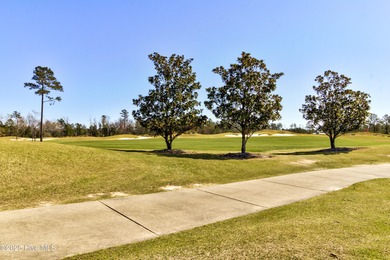 Beautifully updated townhouse tucked away in a peaceful on Cape Fear National At Brunswick Forest in North Carolina - for sale on GolfHomes.com, golf home, golf lot