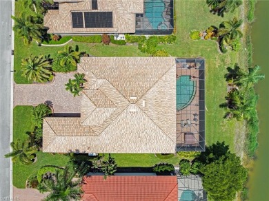 This sought-after Aragon model sits on a premium lakefront lot on Estero Country Club in Florida - for sale on GolfHomes.com, golf home, golf lot
