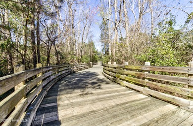 Beautifully updated townhouse tucked away in a peaceful on Cape Fear National At Brunswick Forest in North Carolina - for sale on GolfHomes.com, golf home, golf lot