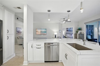 Stunning, completely remodeled end-unit first-floor coach home on West Bay Beach and Golf Club in Florida - for sale on GolfHomes.com, golf home, golf lot