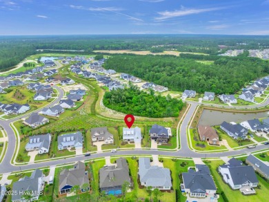 Welcome to 5083 Creswell Drive, a true gem located in the highly on Cape Fear National At Brunswick Forest in North Carolina - for sale on GolfHomes.com, golf home, golf lot