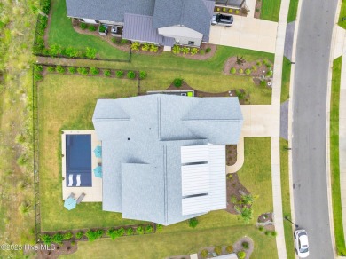 Welcome to 5083 Creswell Drive, a true gem located in the highly on Cape Fear National At Brunswick Forest in North Carolina - for sale on GolfHomes.com, golf home, golf lot