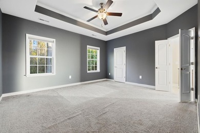 Welcome home! Tucked away in the quiet, low-HOA North Village on Palmetto Greens Golf and Country Club in South Carolina - for sale on GolfHomes.com, golf home, golf lot