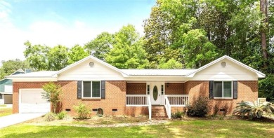 This remodeled 3-bedroom, 2-bath brick home is centrally located on Lake Forest Yacht and Country Club in Alabama - for sale on GolfHomes.com, golf home, golf lot