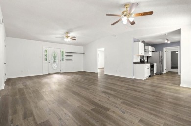 This remodeled 3-bedroom, 2-bath brick home is centrally located on Lake Forest Yacht and Country Club in Alabama - for sale on GolfHomes.com, golf home, golf lot