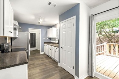 This remodeled 3-bedroom, 2-bath brick home is centrally located on Lake Forest Yacht and Country Club in Alabama - for sale on GolfHomes.com, golf home, golf lot