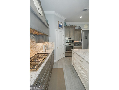 Discover luxury living in this breathtaking 4-bedroom on Laurel Island Links in Georgia - for sale on GolfHomes.com, golf home, golf lot