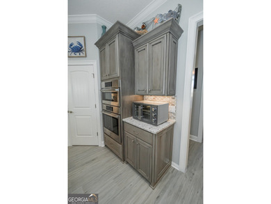 Discover luxury living in this breathtaking 4-bedroom on Laurel Island Links in Georgia - for sale on GolfHomes.com, golf home, golf lot