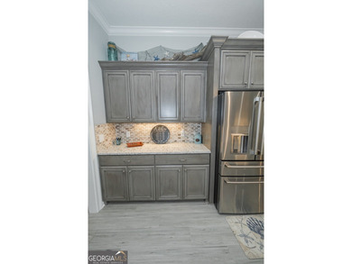 Discover luxury living in this breathtaking 4-bedroom on Laurel Island Links in Georgia - for sale on GolfHomes.com, golf home, golf lot