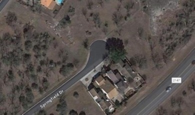 Discover the perfect setting for your custom home on this level on Slick Rock Golf Course - Horseshoe Bay in Texas - for sale on GolfHomes.com, golf home, golf lot