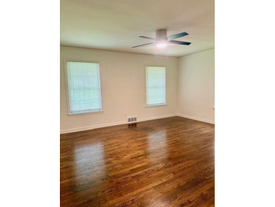 Welcome to this beautifully updated 4-bedroom, 2-bath brick home on Alfred Tup Holmes Golf Course in Georgia - for sale on GolfHomes.com, golf home, golf lot