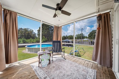Welcome to your dream home! Nestled on a picturesque corner lot on Timberlake Country Club in South Carolina - for sale on GolfHomes.com, golf home, golf lot