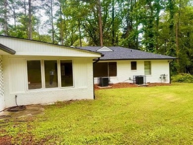 Welcome to this beautifully updated 4-bedroom, 2-bath brick home on Alfred Tup Holmes Golf Course in Georgia - for sale on GolfHomes.com, golf home, golf lot