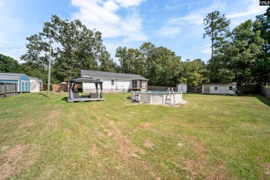 Welcome to your dream home! Nestled on a picturesque corner lot on Timberlake Country Club in South Carolina - for sale on GolfHomes.com, golf home, golf lot