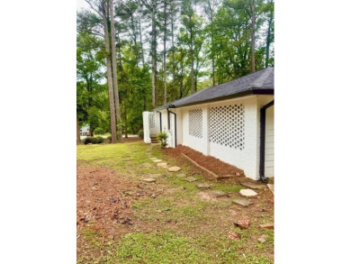 Welcome to this beautifully updated 4-bedroom, 2-bath brick home on Alfred Tup Holmes Golf Course in Georgia - for sale on GolfHomes.com, golf home, golf lot