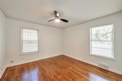 Welcome to this beautifully updated 4-bedroom, 2-bath brick home on Alfred Tup Holmes Golf Course in Georgia - for sale on GolfHomes.com, golf home, golf lot