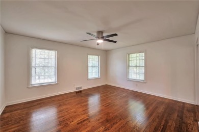 Welcome to this beautifully updated 4-bedroom, 2-bath brick home on Alfred Tup Holmes Golf Course in Georgia - for sale on GolfHomes.com, golf home, golf lot