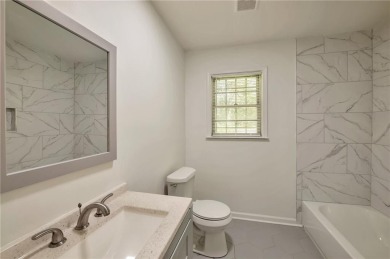 Welcome to this beautifully updated 4-bedroom, 2-bath brick home on Alfred Tup Holmes Golf Course in Georgia - for sale on GolfHomes.com, golf home, golf lot