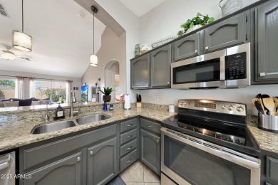 This beautifully updated Furnished extended Oakmont model is on Tuscany Falls At Pebble Creek in Arizona - for sale on GolfHomes.com, golf home, golf lot