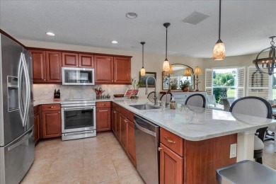 Step inside and be greeted by sweeping golf course views from on Summerglen Country Club in Florida - for sale on GolfHomes.com, golf home, golf lot