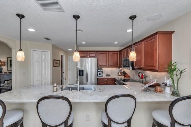 Step inside and be greeted by sweeping golf course views from on Summerglen Country Club in Florida - for sale on GolfHomes.com, golf home, golf lot