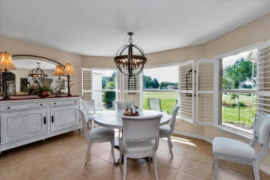 Step inside and be greeted by sweeping golf course views from on Summerglen Country Club in Florida - for sale on GolfHomes.com, golf home, golf lot
